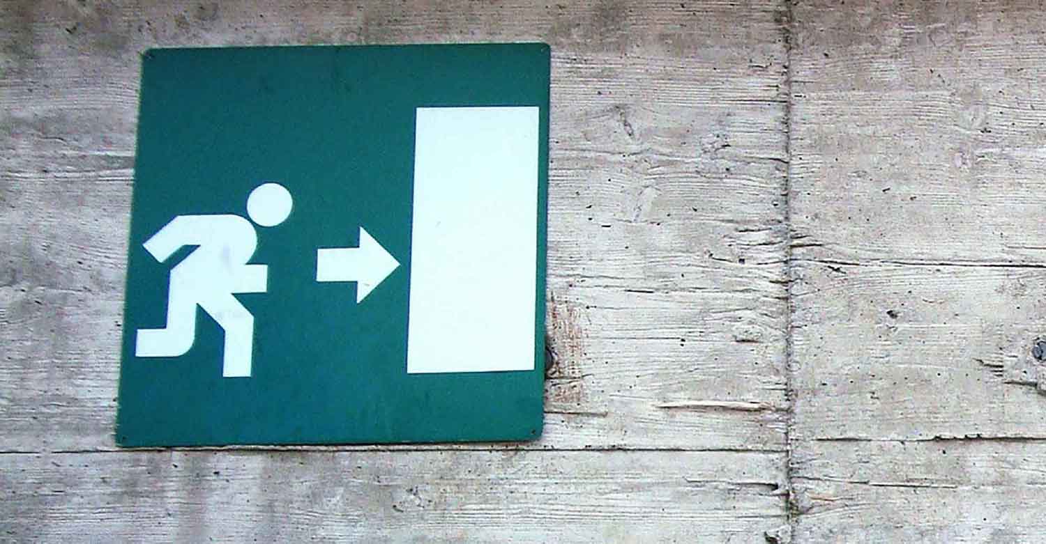 An emergency exit sign that points your business direction to Centratel Telephone Answering Service