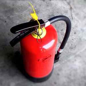 A fire extinguisher reminds that a telephone answering service helps the system in your business
