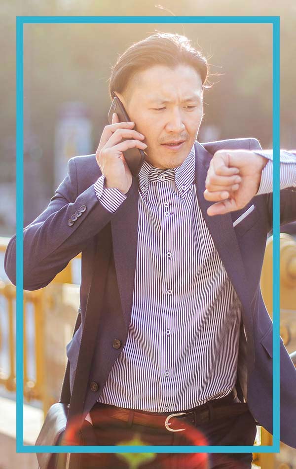 A property manager on the phone with his answering service collecting tenants messages