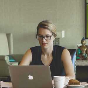 A customer care specialist working late on client requests for Centratel Telephone Answering Service