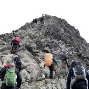 Mountaineers climb a mountain as a comparison for an answering service climbing mountain marketing