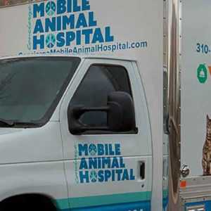 A mobile veterinary clinic on the street near Centratel’s Veterinary Answering Service building
