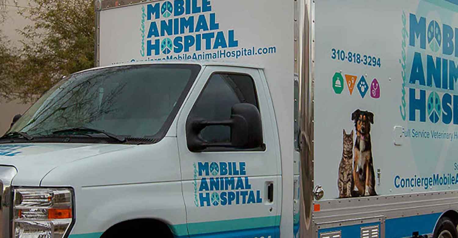 A mobile veterinary clinic on the street near Centratel’s Veterinary Answering Service building