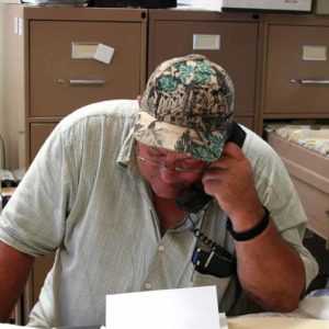 An HVAC expert on the phone with a client while Centratel’s HVAC Answering Service manages all calls