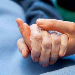 Two hands holding each other hoping to find the right home health and hospice answering service