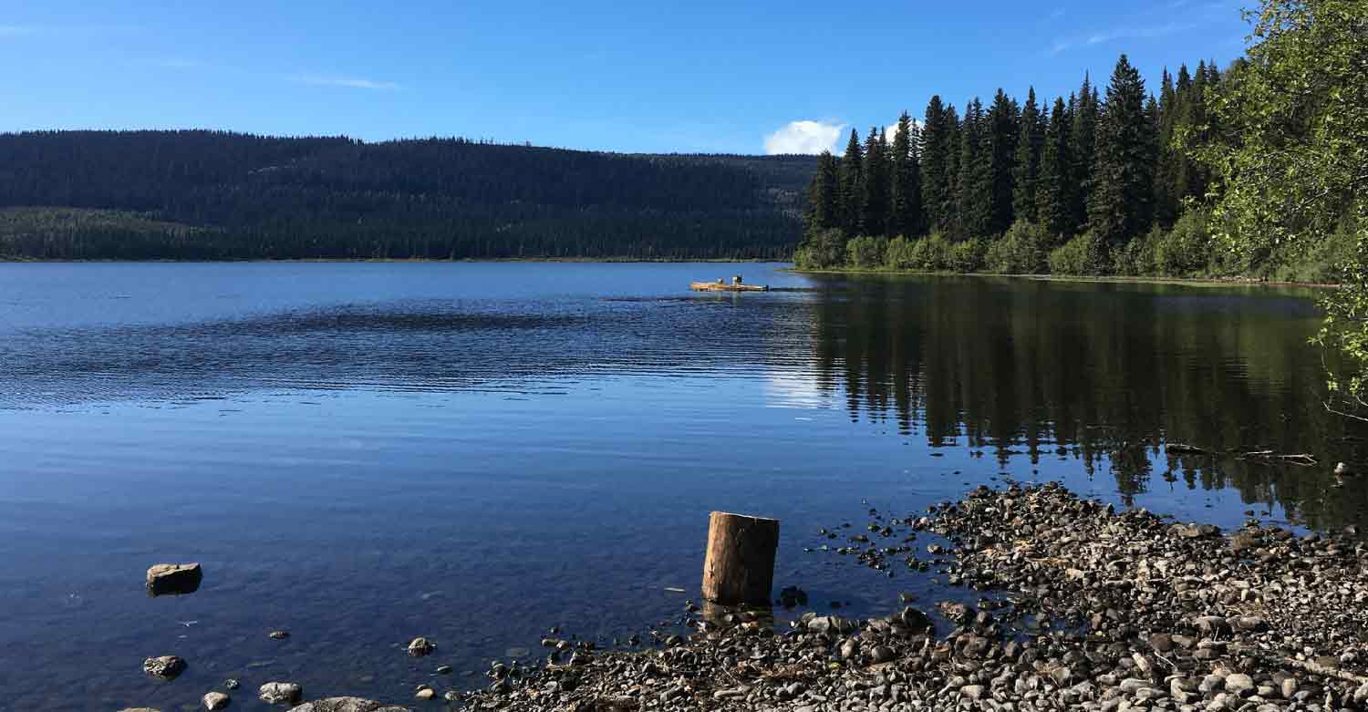 A peaceful lake reminds that Labor day can be peaceful too with an answering service phone coverage