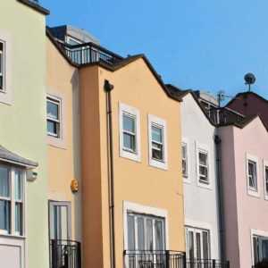 Colored houses maintained by a property management firm with the help of a good answering service