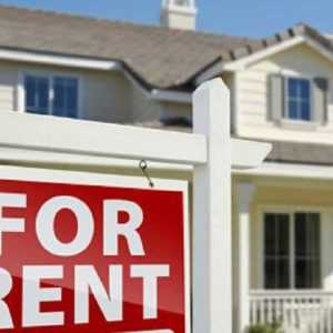 A For Rent sign in front of a house placed by a property manager preparing for the new year