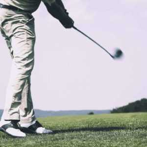 Golf player hits a ball the same way you can drive your business forward hiring an answering service