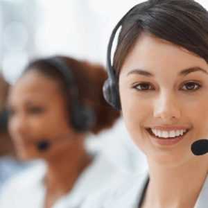 Centratel's Home Health Care telephone answering service representative smiling while taking calls