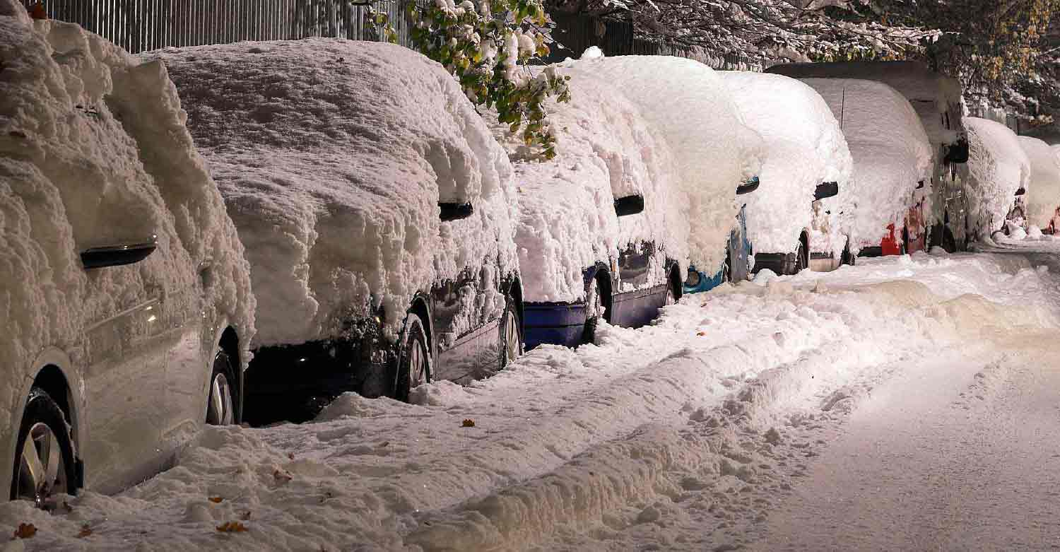 Old man stuck in a car in the middle of a snowstorm calling a health care answering service for help