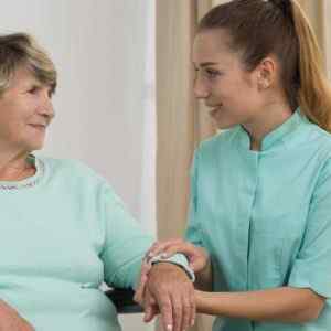 Home nurse with an old woman representing Home HealthCare Workforce served by an answering service