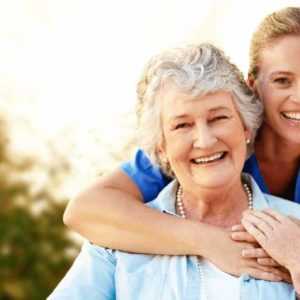 Nurse hugging her patient while her Home Health Answering Service is taking care of incoming calls