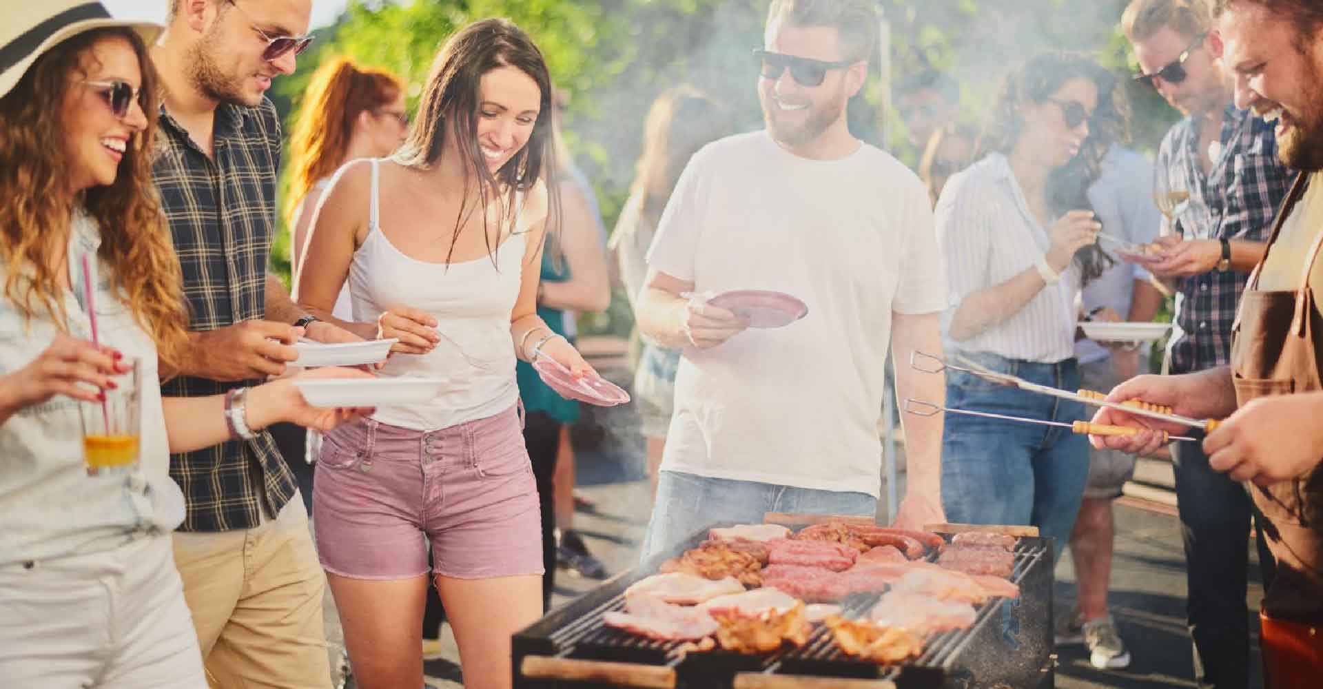 People having fun at a barbeque enjoying the benefits of using an answering service on memorial day