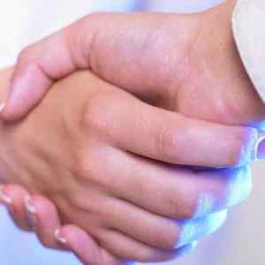 A Home Heath Care business owner shakes his hands with his telephone answering service operator