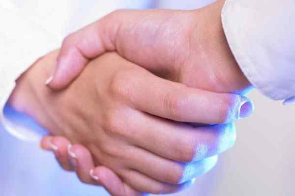 A Home Heath Care business owner shakes his hands with his telephone answering service operator