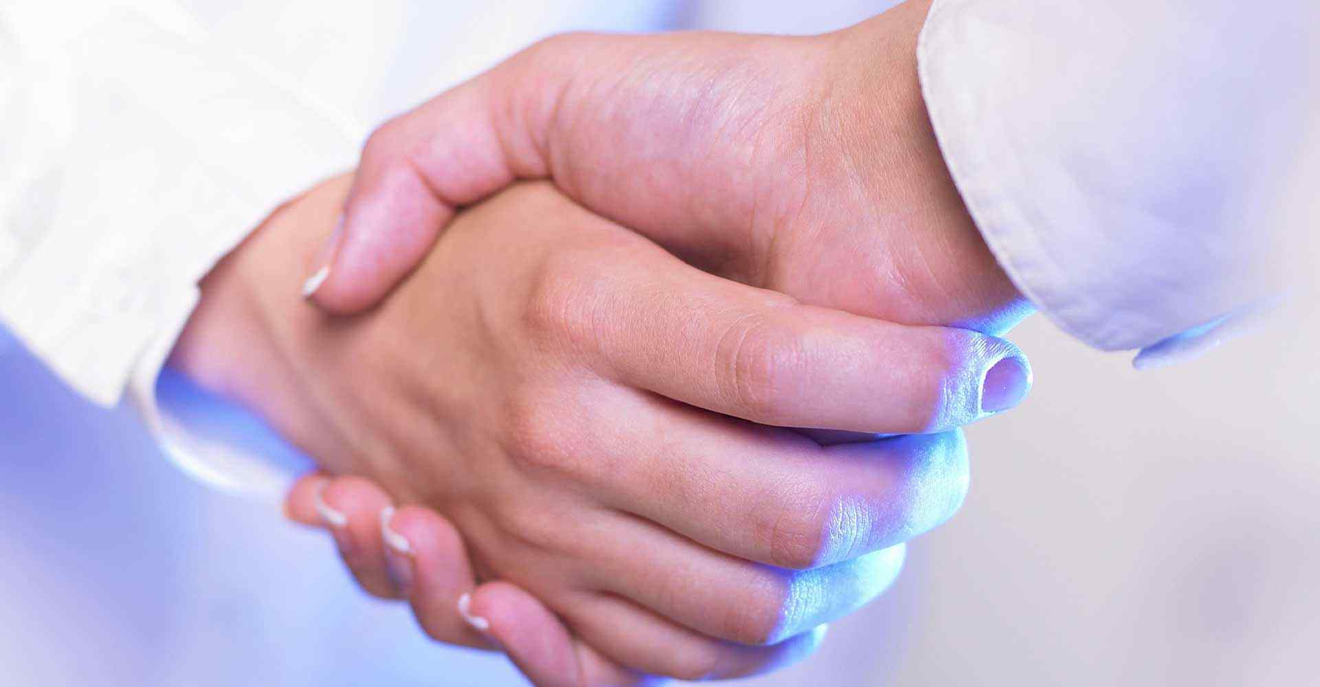 A Home Heath Care business owner shakes his hands with his telephone answering service operator