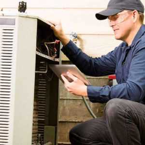 HVAC worker improving efficiency with new technology and industry specific software