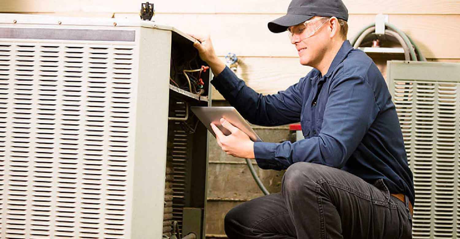 HVAC worker improving efficiency with new technology and industry specific software