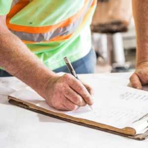 HVAC owner taking notes from a message dispatched from his Telephone Ansering Service