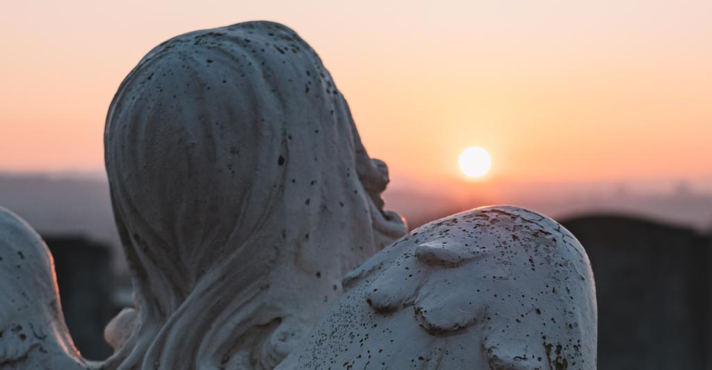 A mourning statue after the funeral day happened thanks to the answering service help