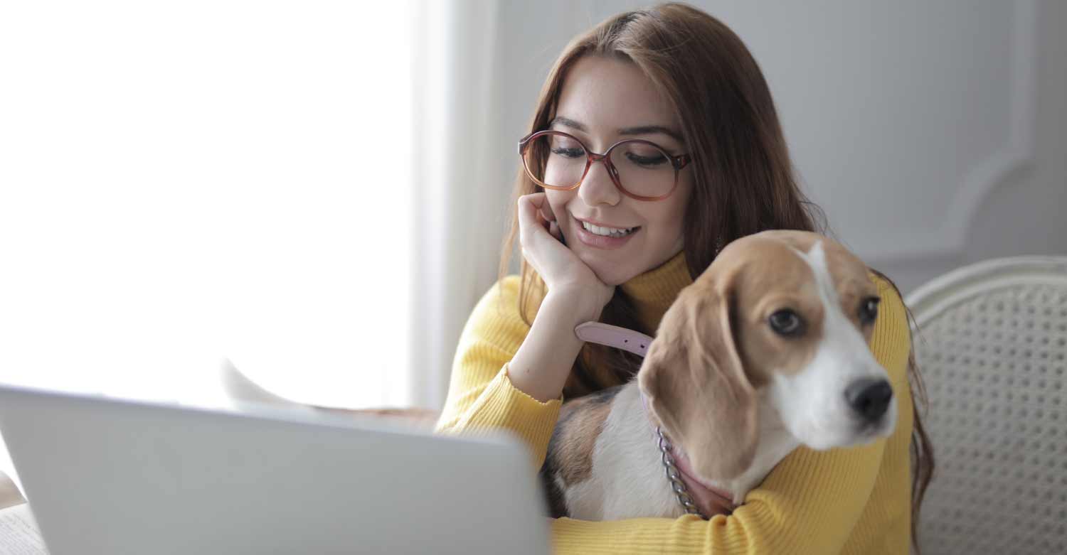 A girl and her pet during the telehealth visit with the veterinarian