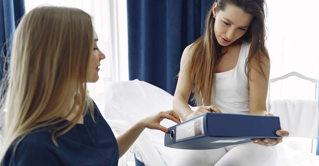 A girl checking her medical records transmitted by Centratel fully HIPAA compliant answering Service