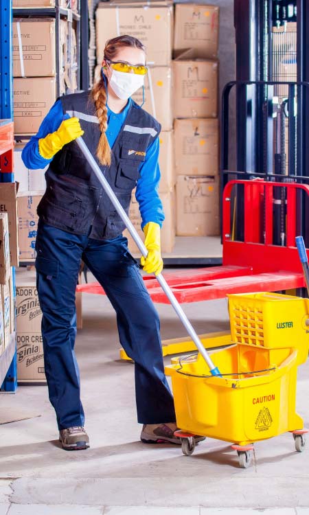 Disaster restoration operator cleaning the room after a call from the answering service