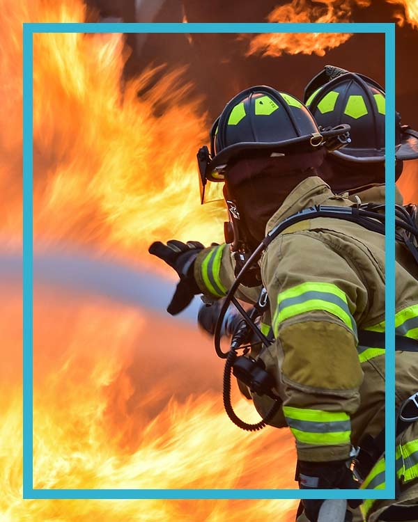 Firemen on the job putting out a fire happened in an HVAC business