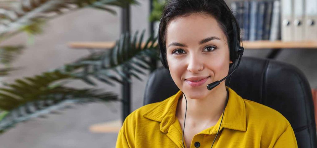 An experienced HVAC telephone answering service specialist helping with calls