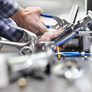 Plumbing business owner while working helped by an HVAC answering service