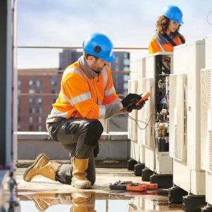 A HVAC technician working while Centratel Telephone Answering Service handles his client's calls