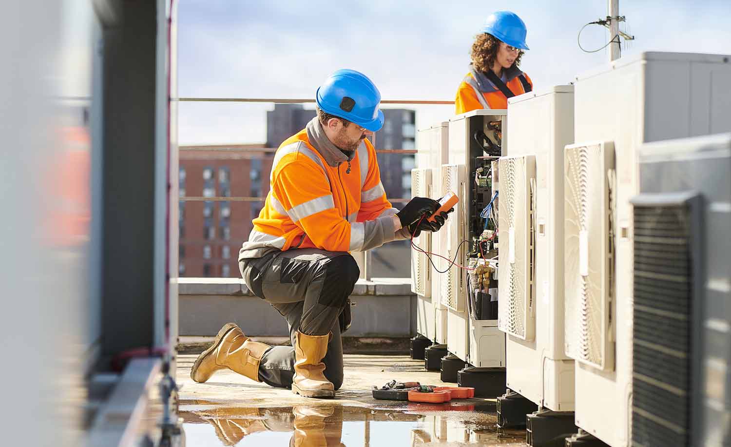 A HVAC technician working while Centratel Telephone Answering Service handles his client's calls