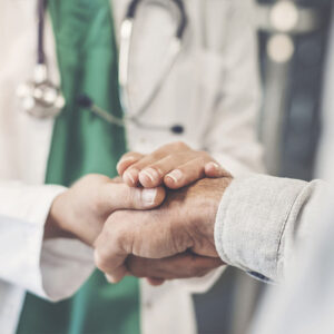 A home health care doctor shaking hands and providing the perfect partnership