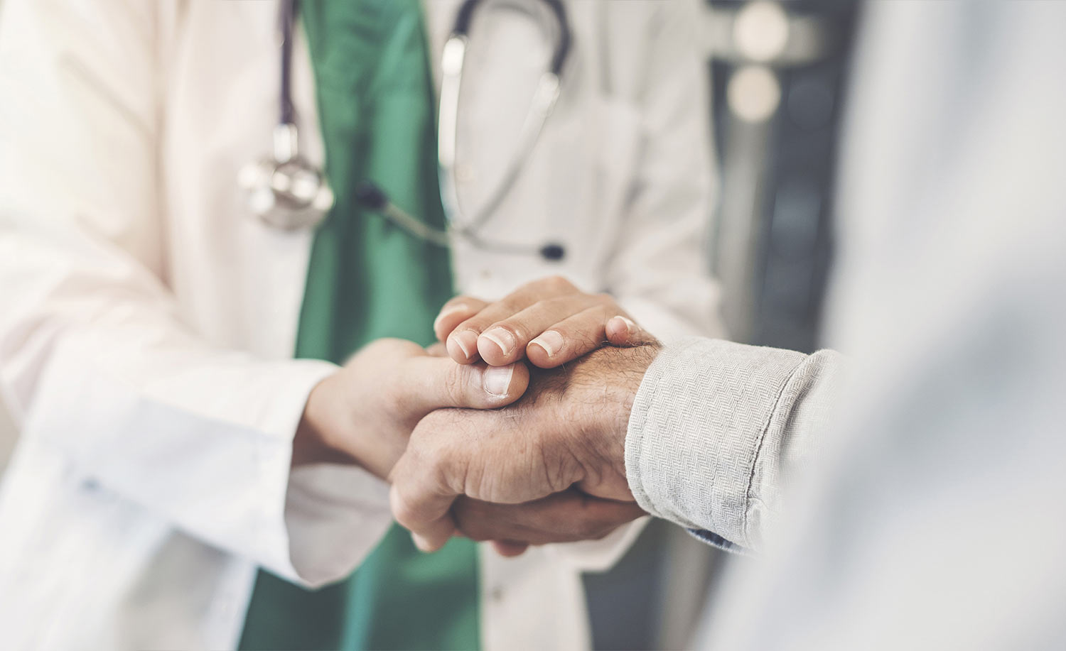 A home health care doctor shaking hands and providing the perfect partnership