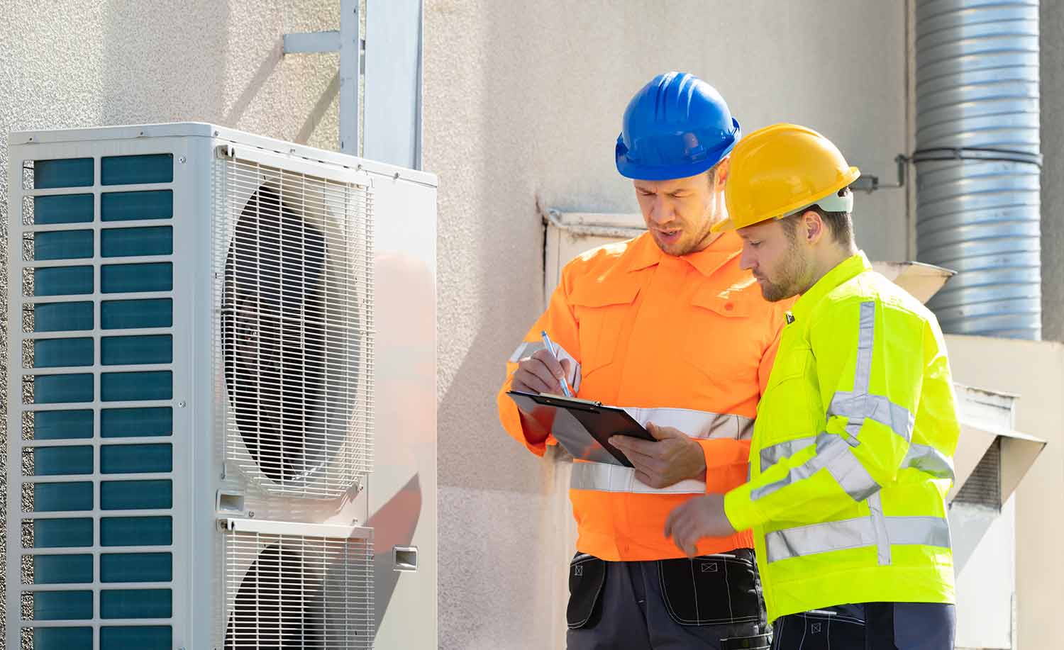 HVAC business owners working togheter on the field