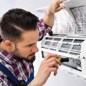 HVAC technician working while Centratel Answering Service manages his client's calls