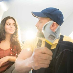 Plumbing business owner taking with the customer helped by a plumbing answering service