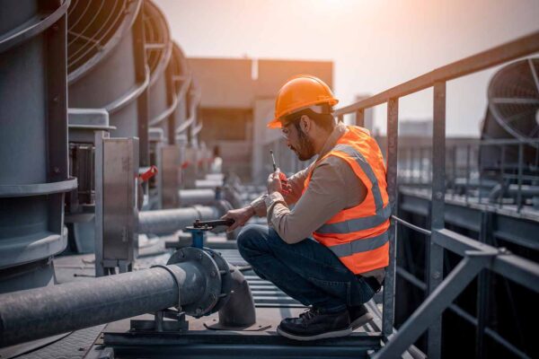 A HVAC technician working with peace of mind while Centratel takes care of his business's operations