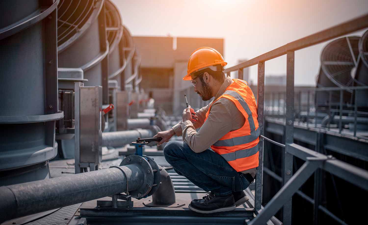 A HVAC technician working with peace of mind while Centratel takes care of his business's operations